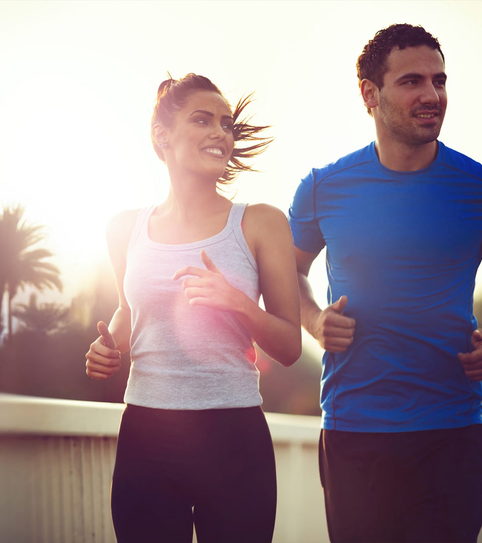 couple running through downtown sarasota